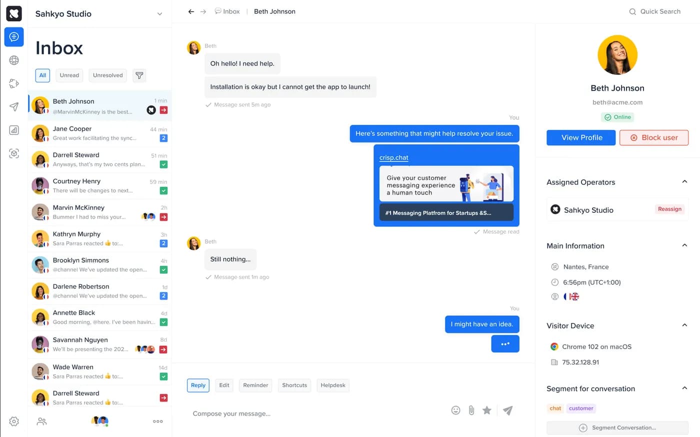 The Crisp inbox: the conversation list with channel badges and the visitor profile